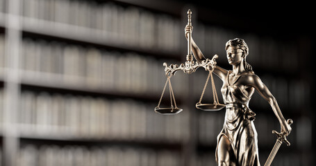 Legal Concept: Themis is the goddess of justice as a symbol of law and order on the background of books