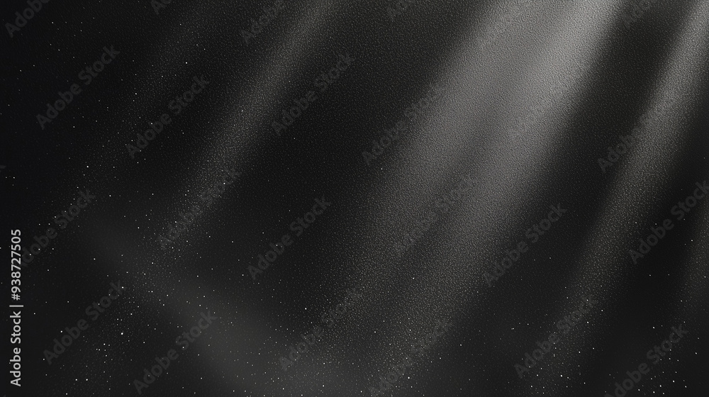 Poster Black matte textured background with floating dust particles illuminated by soft light in the top right corner, creating a deep contrast between black and white. This abstract design emphasizes textur
