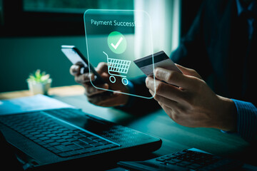 Person Making Online Payment with Credit Card on Laptop, Holographic Interface Showing Payment Successful and Shopping Icons, Representing E-commerce and Digital Transactions