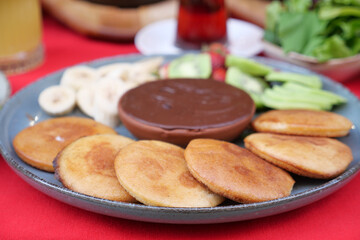 pan cake served with banana and strawberry 