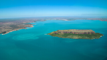 Fototapeta premium Panoramic view on Steep Head Island in the blue waters of Admiralty Gulf off the East Kimberley coast, Western Australia, aerial view 