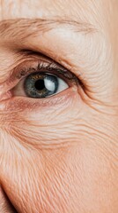 Fototapeta premium A detailed image of a womans face showing natural wrinkles around the eyes and mouth as she smiles The wrinkles are softly lit emphasizing the beauty of aging and the expression of joy creating a posi