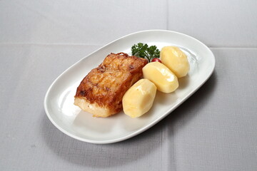 Grilled Cod with Boiled Potatoes on the plate