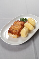 Grilled Cod with Boiled Potatoes on the plate