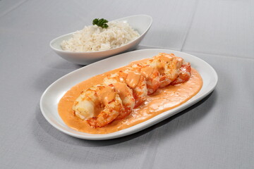 Shrimp Newburg with white rice on a plate