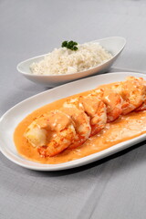 Shrimp Newburg with white rice on a plate