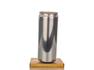 Metal can with drink on wooden stand, macro, isolated on white background.