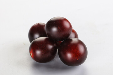 Raw ripe black kumato tomato
