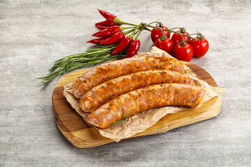 Raw sausages with spices and herbs