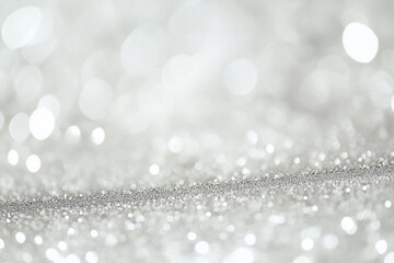 Abstract bokeh lights with a shimmering silver hue fill the image, creating a festive atmosphere. The defocused circles sparkle brightly, offering a dreamy and elegant visual.