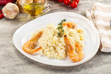 Italian risotto with prawn served thyme