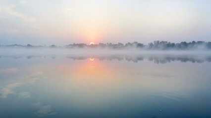 Sunrise Over a Tranquil Lake with Mist Rising - AI Generated