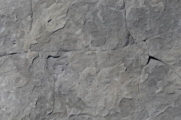 Rocks worn by wind and sea found on a wild beach, which is part of a geopark.