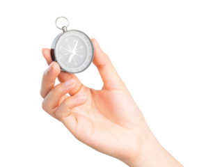 Hand holding compass on isolated white background.