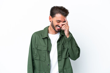 Young caucasian man isolated on white background laughing