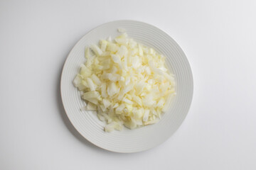 A plate of finely chopped onions, perfect for meal prep and cooking recipes, kitchen preparation concept