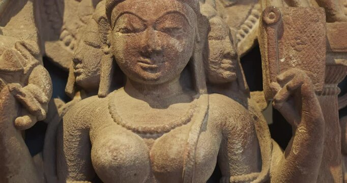 Close-up view on Ancient Stone Bas-relief Of Brahmani Or Brahmi, One Of Seven Hindu Mother Goddesses Known As Sapta Matrikas. She Is Aspect Of Adi Shakti, Possessing rajas Guna And Is Therefore Source