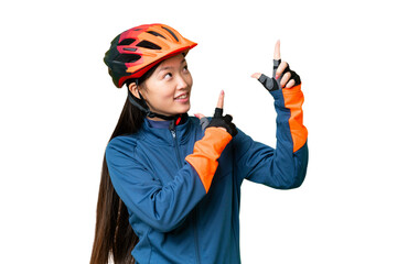 Young cyclist woman over isolated chroma key background pointing with the index finger a great idea