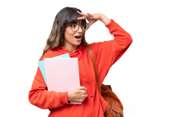 Young student caucasian woman over isolated background doing surprise gesture while looking to the side