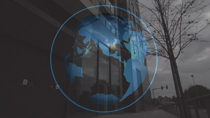 Rotating globe animation over modern building with cloudy sky in background - Powered by Adobe