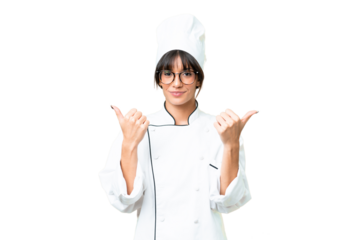 Young caucasian chef  woman over isolated chroma key background with thumbs up gesture and smiling