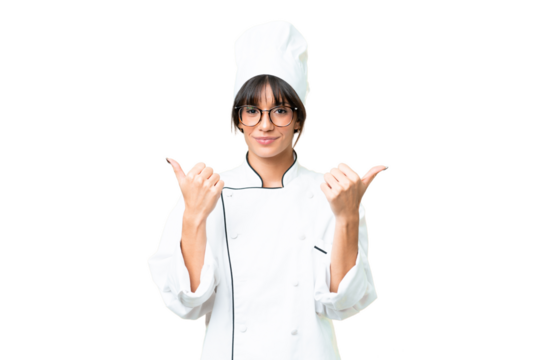 Young caucasian chef  woman over isolated chroma key background with thumbs up gesture and smiling