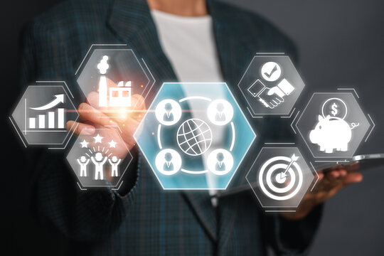 Businessman using a virtual interface to illustrate the concept of outsourcing and various business strategies, including growth, partnership, and financial planning.
