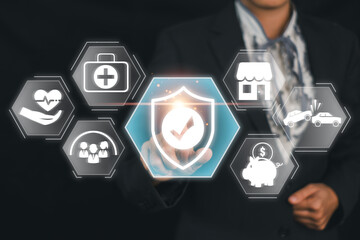 Businessman in a suit interacting with virtual insurance icons representing various types of coverage including health, home, car, and financial security.