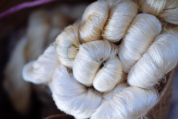 Natural silk in a basket, North Thailand