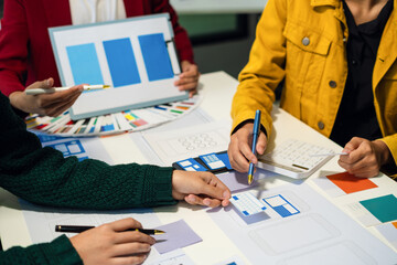 UX developer and ui designer brainstorming about mobile app interface wireframe design with customer breif and color code, User experience concept