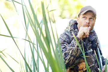 Man, hunting and duck whistle outdoor for camouflage, wildlife target and adventure activity of...