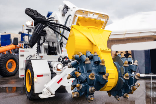 Truck hydraulic harvester with drilling head of mine roadheader. Concept underground mining of coal and ore
