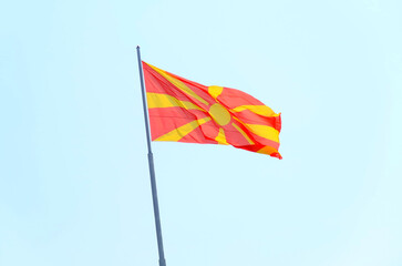 Flag of North Macedonia waving against sky
