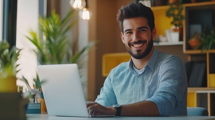 Modern office scene with a stylish Hispanic businessman working on an e-commerce startup, smiling