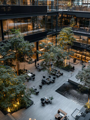 modern office space with indoor trees, natural light wells, and water features