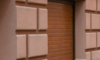 luxury apartment outdoor exterior facade textured wall perspective surface garage door closed entrance close up picture