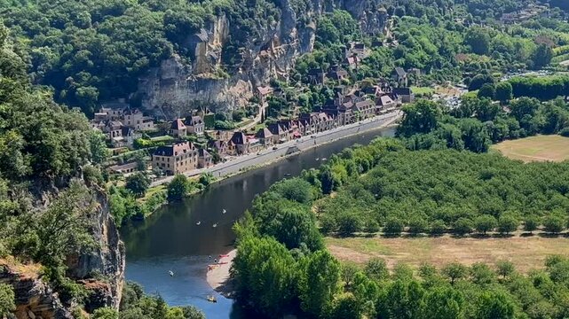 Kayaking at Dordogne river, in La Roque-Gageac, in the Perigord, France. High quality 4k footage