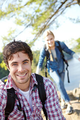 Obraz premium Happy man, portrait or couple hiking in nature for travel, outdoor adventure or journey in woods. Mountain, hikers or people in forest together on holiday vacation, lake trip or break to explore park