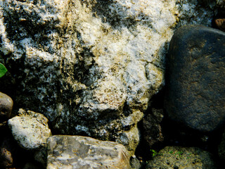 Abstract background with mountain rocks. Large shaped rocks that can be found on the shore of the sea, lake or river.