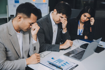 Group of colleagues engaging in a discussion during a business meeting in a conference room. Happy business people, men and women, collaborating and working towards their shared goals.