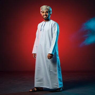 Omani arab man posing for camera on a colorful background