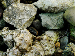 Abstract background with mountain rocks. Large shaped rocks that can be found on the shore of the sea, lake or river.