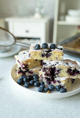 Easy sponge cake with blueberries fresh and homemade baked on kitchen counter
