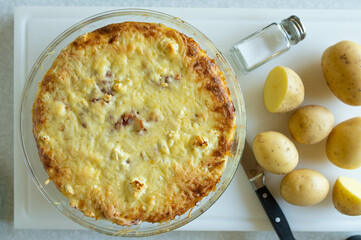 Delicious german potato casserole fresh and homemade cooked on kitchen counter