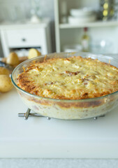 Homemade potato casserole fresh baked on kitchen counter