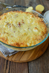 Homemade potato casserole with ham, cheese, eggs and cream.
