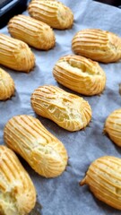 eclairs on a baking sheet. food concept. dessert