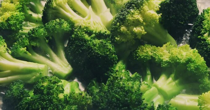 Close-up of ooking broccoli in a frying pan. Homemade healthy, veggie food