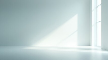 A large, empty room with a window in the corner