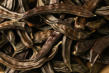 carob pods in the process of ripening